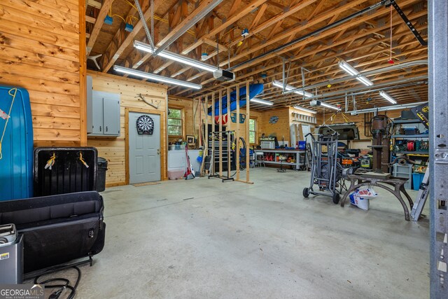 534 Mountainside Dr, Rabun Gap, GA 30568 - garage featuring a workshop area and a garage door opener