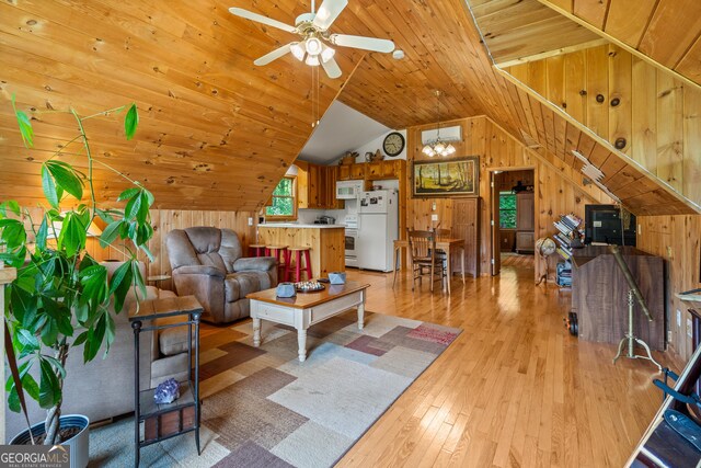 534 Mountainside Dr, Rabun Gap, GA 30568 - living area featuring wooden walls, light wood-style floors, a ceiling fan, vaulted ceiling, and wood ceiling