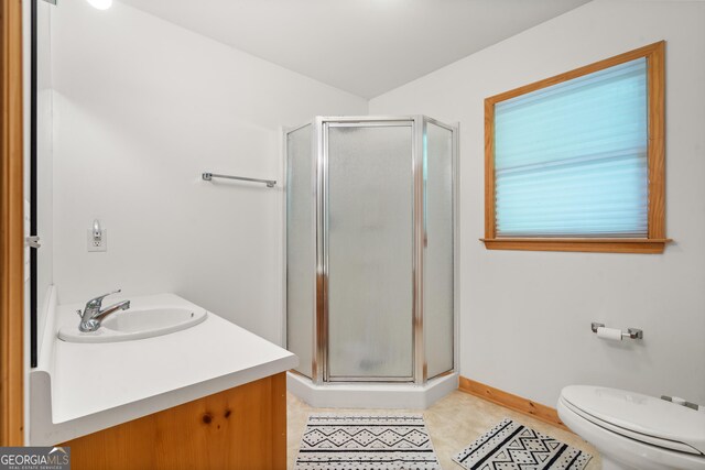 534 Mountainside Dr, Rabun Gap, GA 30568 - bathroom featuring a stall shower, toilet, vanity, and baseboards