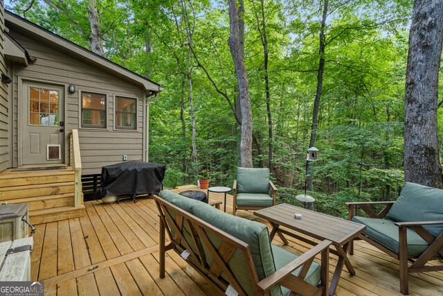 534 Mountainside Dr, Rabun Gap, GA 30568 - wooden terrace with area for grilling and outdoor lounge area