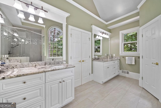 120 Forest Breeze Cv, Alpharetta, GA 30022 - full bath featuring a stall shower, vaulted ceiling, two vanities, plenty of natural light, and tile patterned flooring