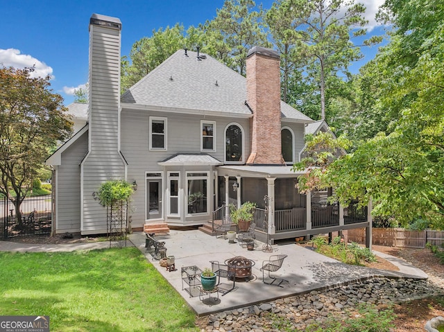 120 Forest Breeze Cv, Alpharetta, GA 30022 - back of house with a chimney, an outdoor fire pit, a patio, and roof with shingles