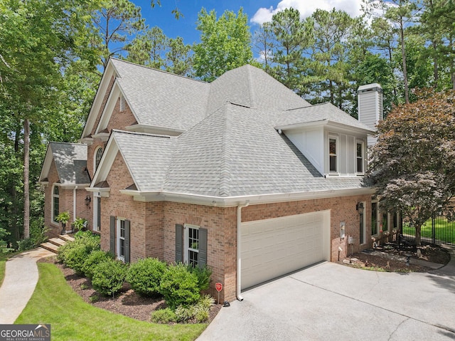 120 Forest Breeze Cv, Alpharetta, GA 30022 - view of side of property featuring a shingled roof, a chimney, driveway, and brick siding