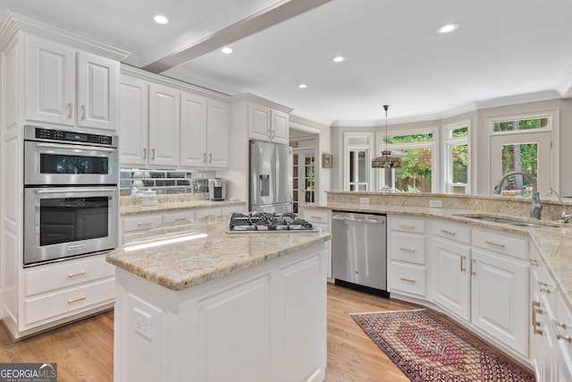 120 Forest Breeze Cv, Alpharetta, GA 30022 - kitchen featuring appliances with stainless steel finishes, light wood-style floors, white cabinetry, ornamental molding, and beamed ceiling