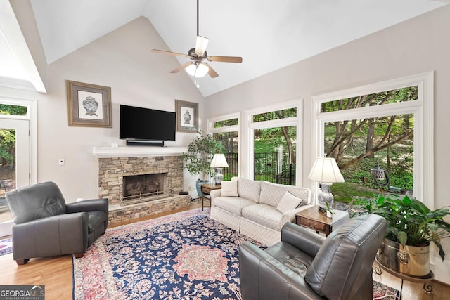 120 Forest Breeze Cv, Alpharetta, GA 30022 - living room featuring a ceiling fan, high vaulted ceiling, wood finished floors, and a fireplace