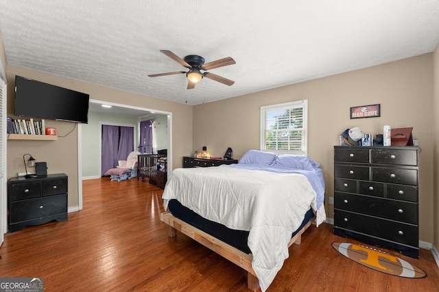 157 Glendale Hts, Winterville, GA 30683 - bedroom with wood finished floors, baseboards, and a ceiling fan