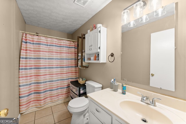 157 Glendale Hts, Winterville, GA 30683 - bathroom with toilet, vanity, a textured ceiling, tile patterned floors, and a shower with shower curtain