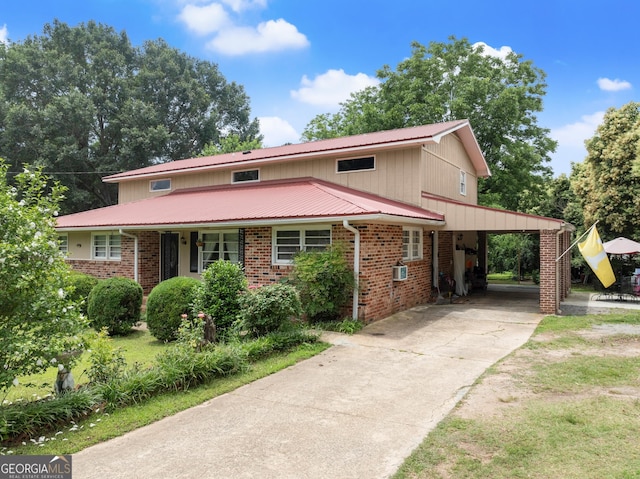 157 Glendale Hts, Winterville, GA 30683 - view of front facade with driveway, an attached carport, metal roof, and brick siding