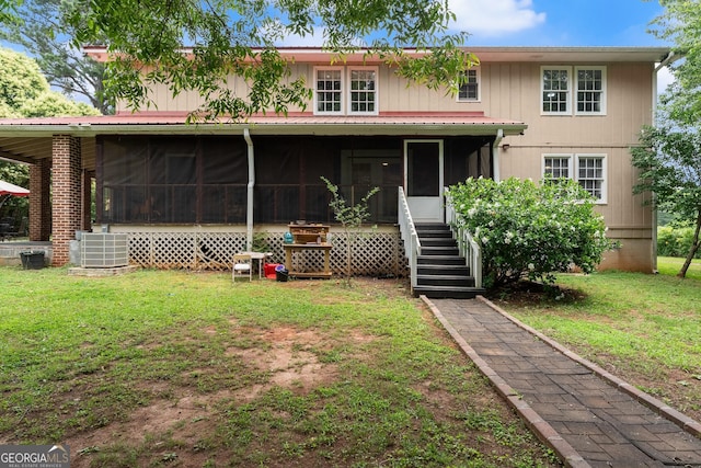 157 Glendale Hts, Winterville, GA 30683 - back of house featuring a sunroom, a yard, and central AC unit