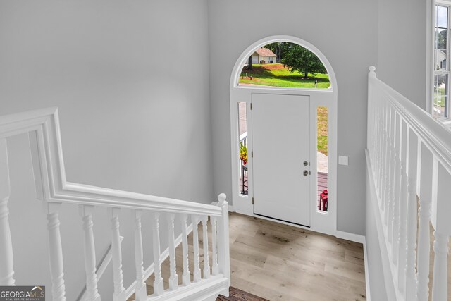 1407 Water Wheel Dr, Bethlehem, GA 30620 - entrance foyer featuring wood finished floors and a towering ceiling