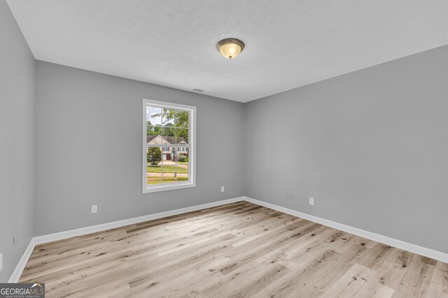 1407 Water Wheel Dr, Bethlehem, GA 30620 - unfurnished room featuring wood finished floors and baseboards