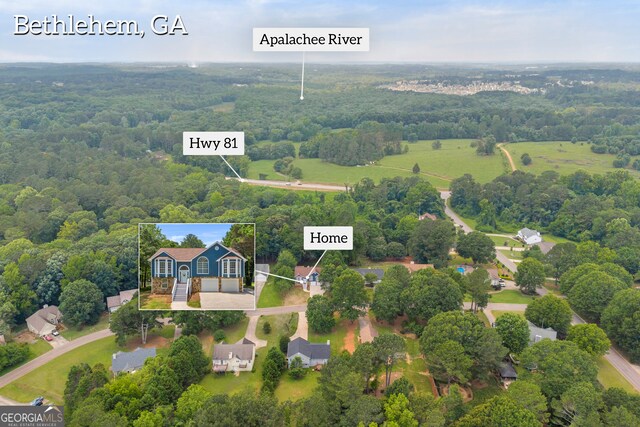 1407 Water Wheel Dr, Bethlehem, GA 30620 - aerial view of property and surrounding area with a heavily wooded area and property parcel outlined