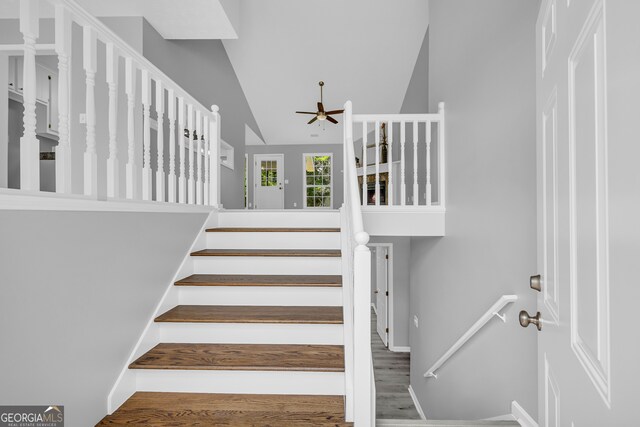 1407 Water Wheel Dr, Bethlehem, GA 30620 - stairway featuring ceiling fan, wood finished floors, baseboards, and high vaulted ceiling