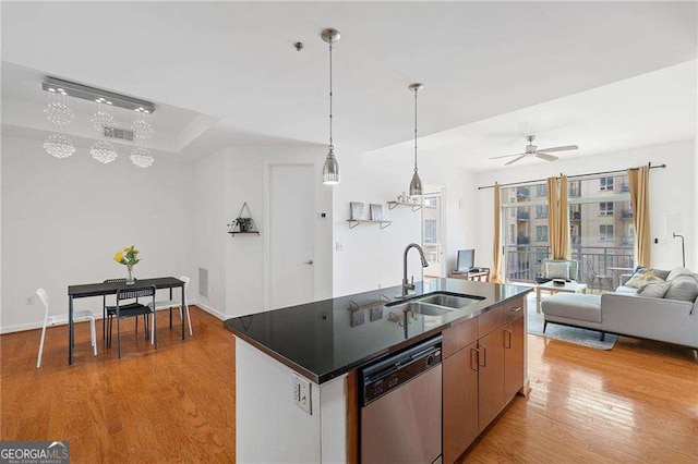 711 Cosmopolitan Dr NE Unit 300, Atlanta, GA 30324 - kitchen featuring a sink, dishwasher, light wood finished floors, ceiling fan, and dark countertops