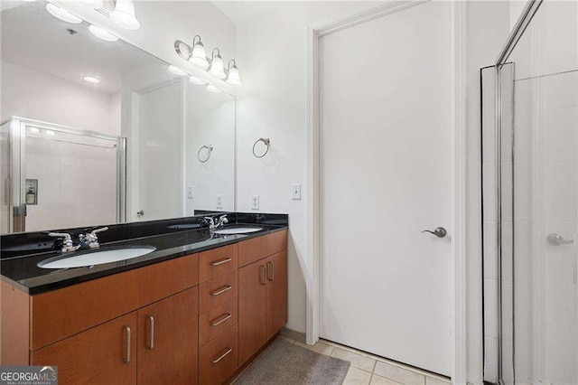 711 Cosmopolitan Dr NE Unit 300, Atlanta, GA 30324 - bathroom with tile patterned flooring, double vanity, and a shower stall