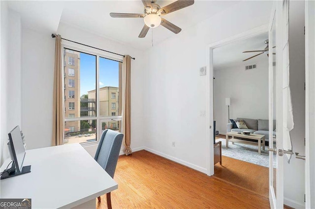 711 Cosmopolitan Dr NE Unit 300, Atlanta, GA 30324 - office featuring a ceiling fan, light wood-type flooring, and baseboards