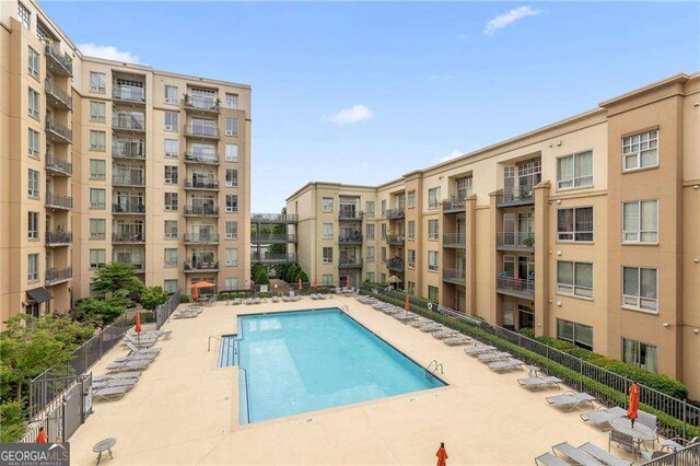 711 Cosmopolitan Dr NE Unit 300, Atlanta, GA 30324 - community pool featuring a patio area
