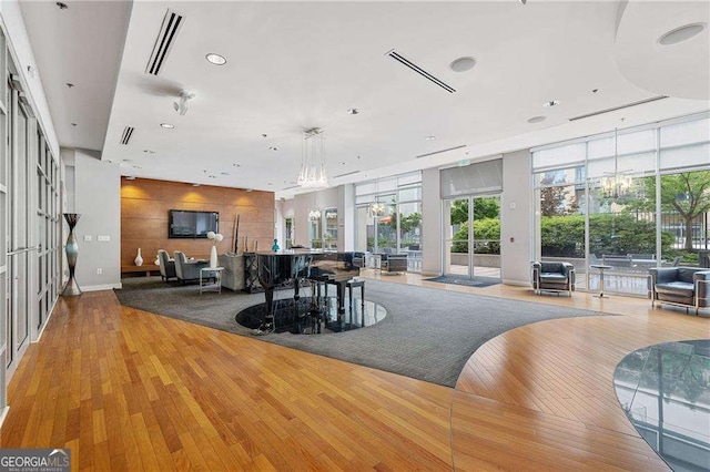 711 Cosmopolitan Dr NE Unit 300, Atlanta, GA 30324 - dining room with wood finished floors, healthy amount of natural light, recessed lighting, and a chandelier
