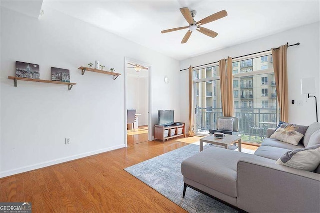 711 Cosmopolitan Dr NE Unit 300, Atlanta, GA 30324 - living room with wood finished floors, ceiling fan, and baseboards
