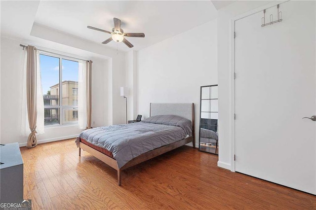 711 Cosmopolitan Dr NE Unit 300, Atlanta, GA 30324 - bedroom featuring light wood-style flooring, ceiling fan, and baseboards
