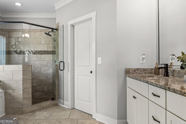 1111 Cobblestone Dr, Bogart, GA 30622 - bathroom featuring vanity, a shower stall, tile patterned flooring, baseboards, and ornamental molding