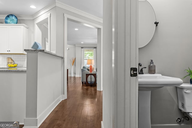 1111 Cobblestone Dr, Bogart, GA 30622 - hallway with dark wood-style flooring, recessed lighting, baseboards, and a sink
