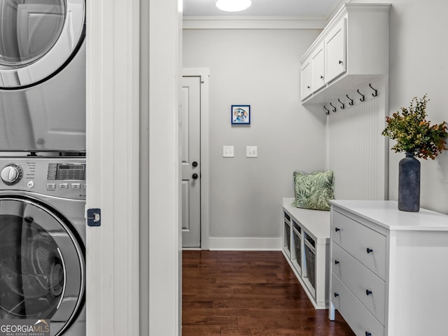 1111 Cobblestone Dr, Bogart, GA 30622 - laundry room featuring stacked washer / drying machine, dark wood-style flooring, and baseboards