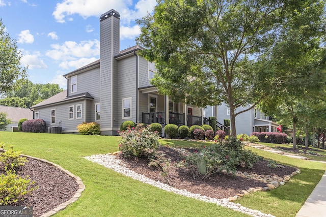 1111 Cobblestone Dr, Bogart, GA 30622 - view of side of home featuring a chimney, central air condition unit, and a yard
