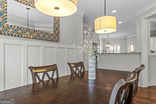 1111 Cobblestone Dr, Bogart, GA 30622 - dining room featuring crown molding, recessed lighting, wood finished floors, a decorative wall, and a chandelier
