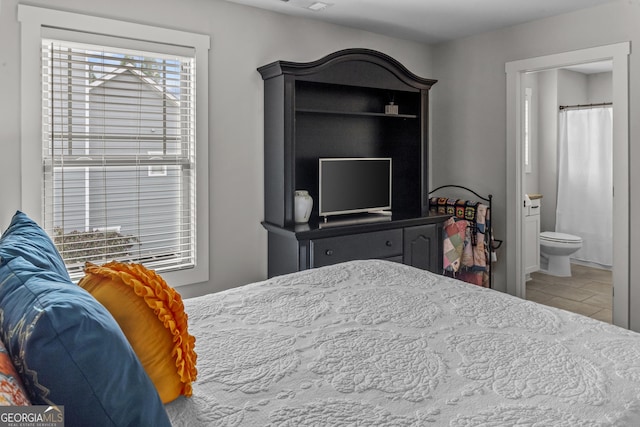 1111 Cobblestone Dr, Bogart, GA 30622 - bedroom with tile patterned floors and ensuite bathroom
