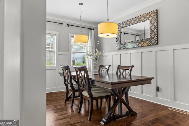 1111 Cobblestone Dr, Bogart, GA 30622 - dining space with a decorative wall, ornamental molding, a wainscoted wall, and dark wood-style floors