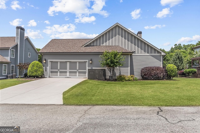1111 Cobblestone Dr, Bogart, GA 30622 - view of front facade with a garage, concrete driveway, a front yard, board and batten siding, and a shingled roof