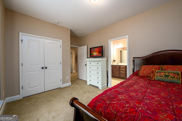 13042 Dartmore Ave, Alpharetta, GA 30005 - bedroom with light carpet, baseboards, a closet, and ensuite bath