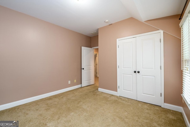 13042 Dartmore Ave, Alpharetta, GA 30005 - unfurnished bedroom with carpet floors, baseboards, a closet, and vaulted ceiling