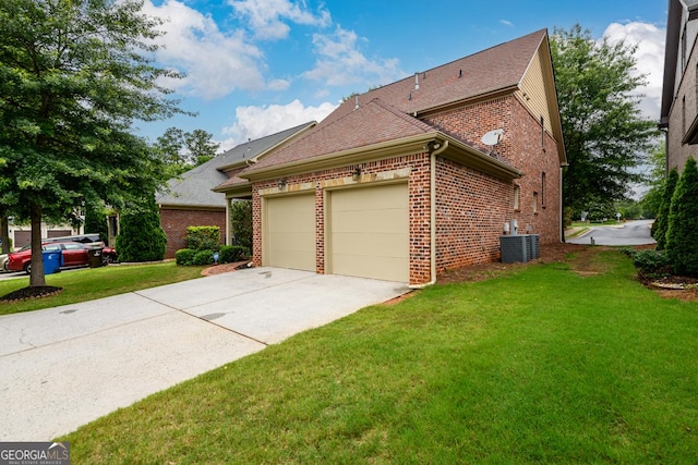 13042 Dartmore Ave, Alpharetta, GA 30005 - view of property exterior featuring an attached garage, brick siding, a lawn, concrete driveway, and central air condition unit