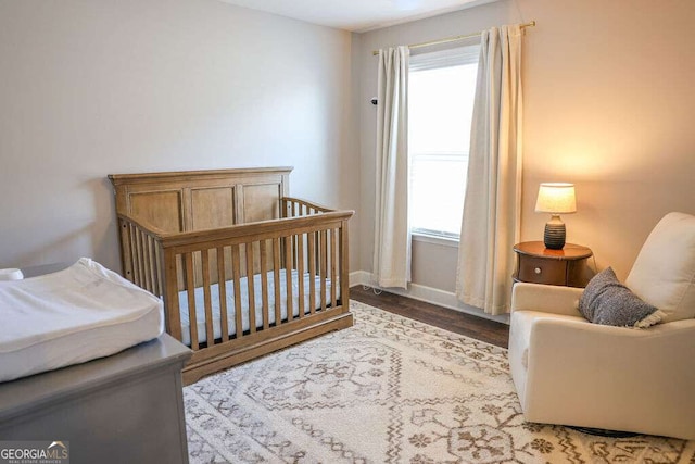 6298 Pierless Ave, Sugar Hill, GA 30518 - bedroom featuring wood finished floors and a nursery area