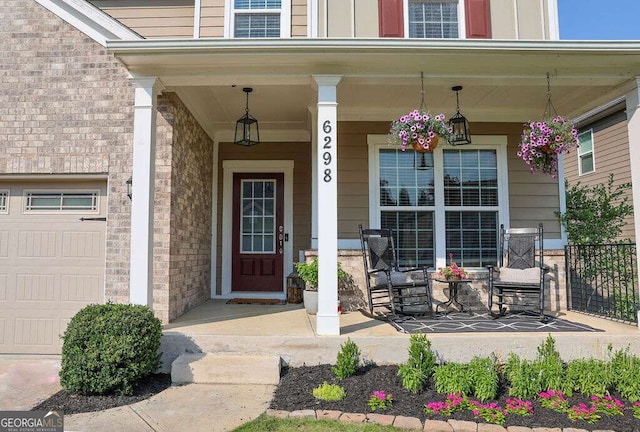 6298 Pierless Ave, Sugar Hill, GA 30518 - doorway to property featuring a porch