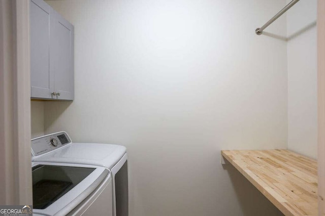 6298 Pierless Ave, Sugar Hill, GA 30518 - washroom featuring washing machine and clothes dryer and cabinet space
