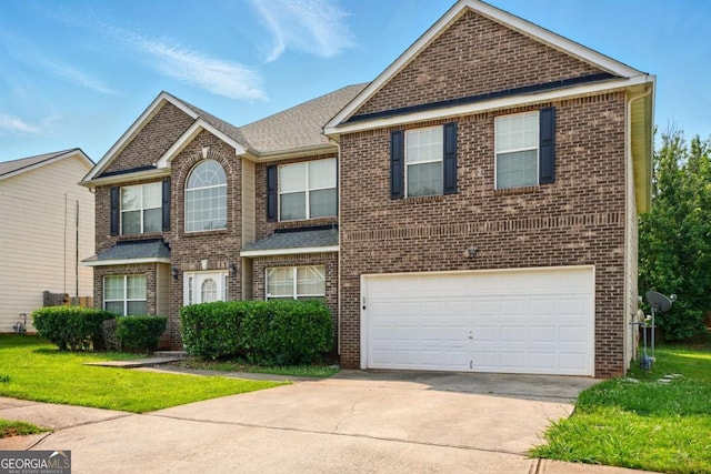 3731 Laramie Rd, Ellenwood, GA 30294 - traditional-style house featuring brick siding, an attached garage, concrete driveway, a front yard, and roof with shingles