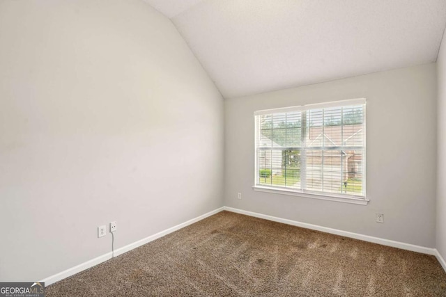 3731 Laramie Rd, Ellenwood, GA 30294 - spare room featuring lofted ceiling, carpet, and baseboards