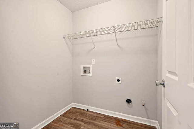 3731 Laramie Rd, Ellenwood, GA 30294 - washroom with gas dryer hookup, hookup for a washing machine, electric dryer hookup, and dark wood-style floors