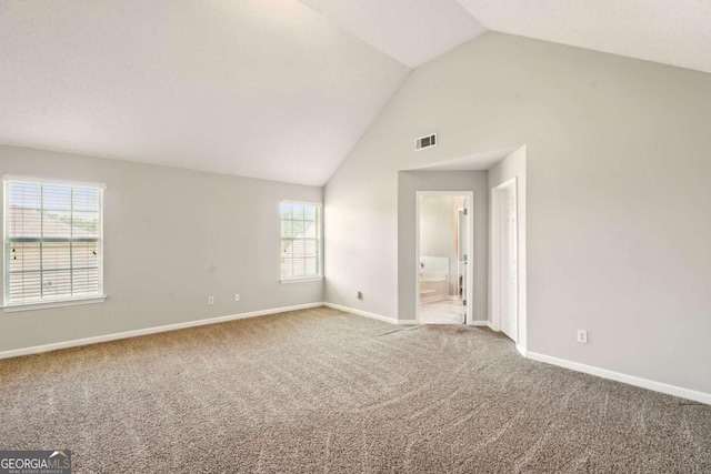 3731 Laramie Rd, Ellenwood, GA 30294 - unfurnished room featuring vaulted ceiling, carpet flooring, baseboards, and healthy amount of natural light