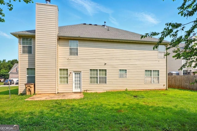 3731 Laramie Rd, Ellenwood, GA 30294 - back of property with a chimney and a patio area