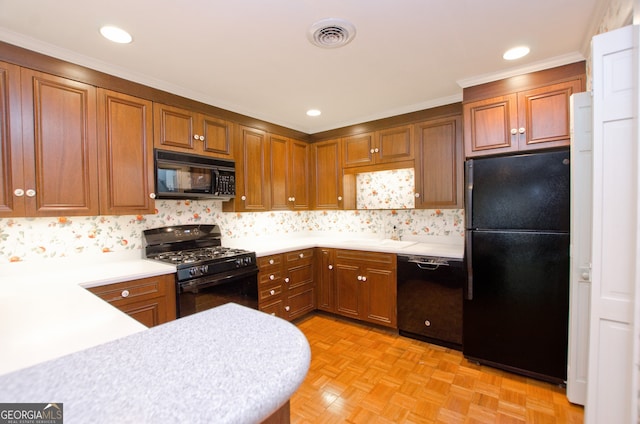 2734 Peachtree Rd NW Unit C-404, Atlanta, GA 30305 - kitchen with black appliances, a sink, light countertops, brown cabinets, and crown molding