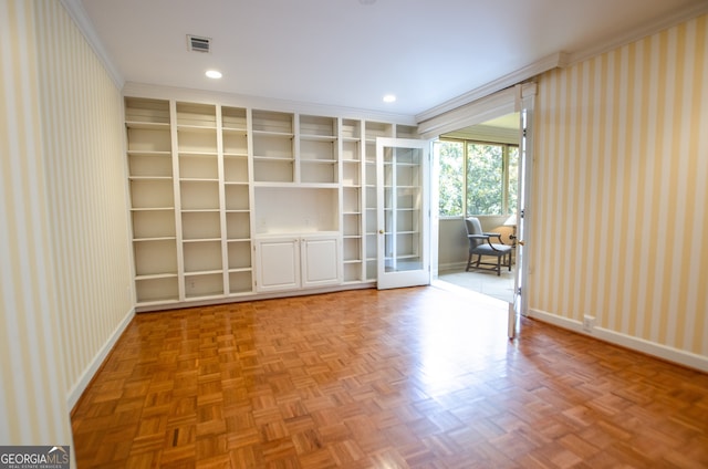 2734 Peachtree Rd NW Unit C-404, Atlanta, GA 30305 - empty room with wallpapered walls, ornamental molding, baseboards, french doors, and built in shelves