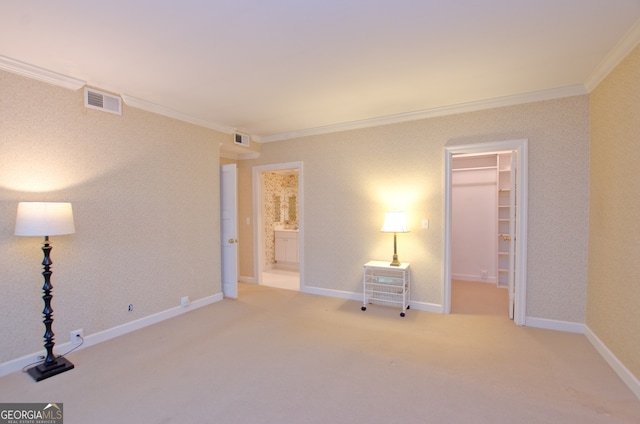 2734 Peachtree Rd NW Unit C-404, Atlanta, GA 30305 - unfurnished bedroom featuring crown molding, carpet, a walk in closet, baseboards, and ensuite bathroom