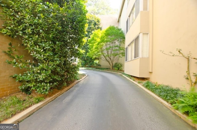 2734 Peachtree Rd NW Unit C-404, Atlanta, GA 30305 - view of asphalt road featuring curbs