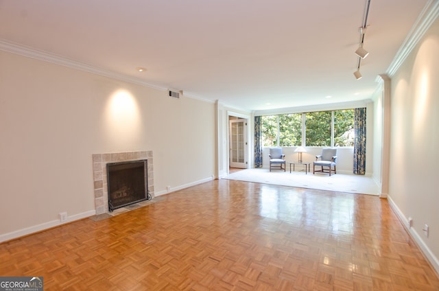 2734 Peachtree Rd NW Unit C-404, Atlanta, GA 30305 - unfurnished living room featuring baseboards, rail lighting, ornamental molding, and a tile fireplace