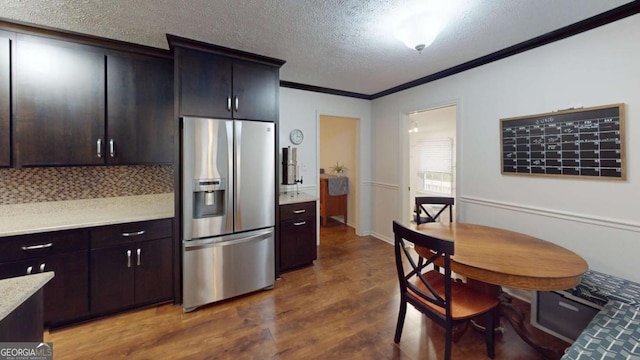2060 Simonton Bridge Rd, Watkinsville, GA 30677 - kitchen featuring stainless steel refrigerator with ice dispenser, ornamental molding, wood finished floors, a textured ceiling, and decorative backsplash