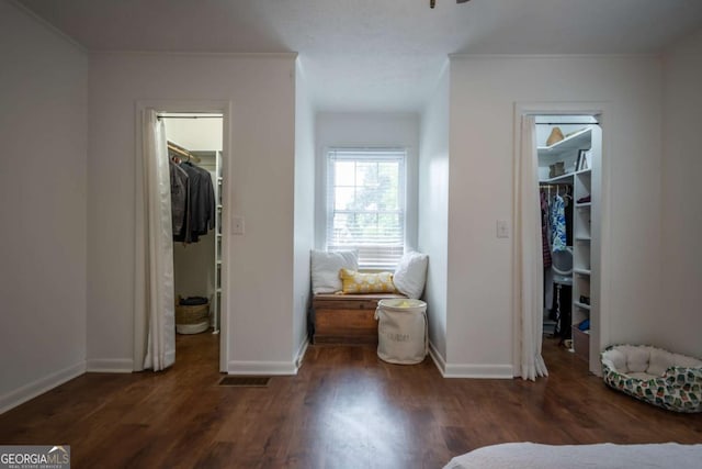 2060 Simonton Bridge Rd, Watkinsville, GA 30677 - bedroom with a spacious closet, a closet, wood finished floors, and crown molding